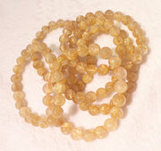 Bracelet of natural stone beads gold rutil quartz attracting stones