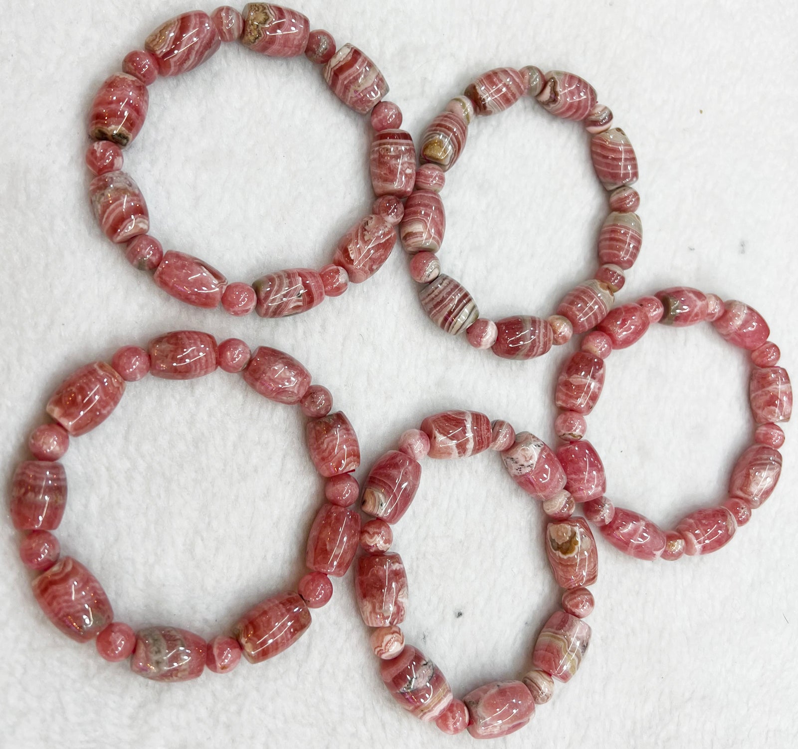 Bracelet of natural stone beads rhodachrosite attracting stones