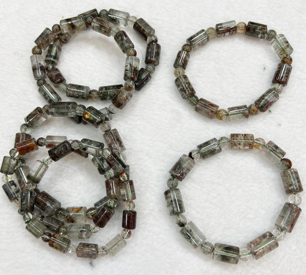 Bracelet of natural stone beads of rutil quartz attracting stones
