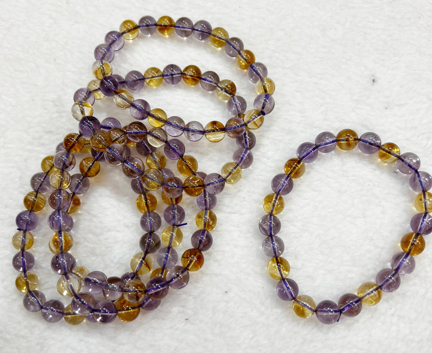 Bracelet of natural stone beads of ametrine attracting stones