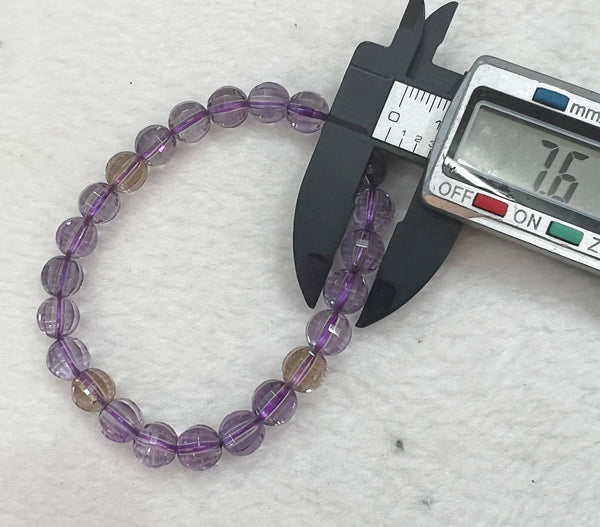 Bracelet of natural stone beads of faceted ametrine attracting stones