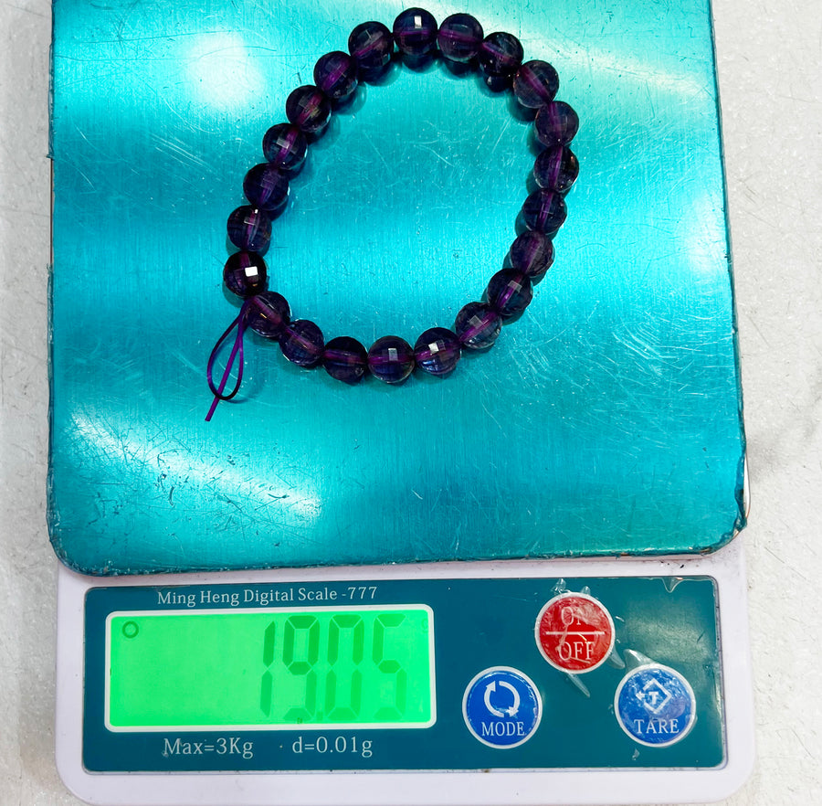 Bracelet of natural stone beads of faceted ametrine attracting stones
