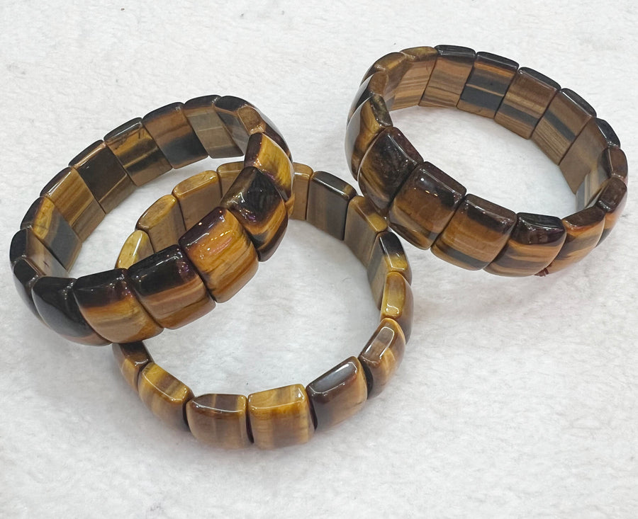 Armband aus Natursteinperlen aus Tigerauge, die Steine ​​anziehen