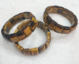 Bracelet of natural stone beads of tiger eye attracting stones