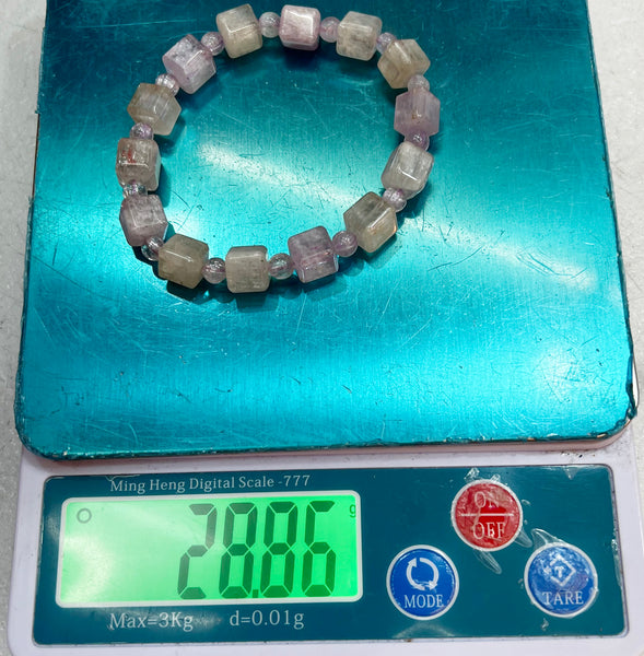 Bracelet of natural stone beads of kunzite attracting stones