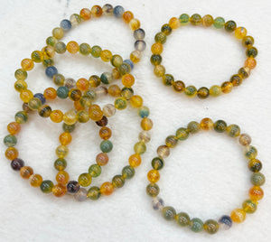 Bracelet of natural stone beads of calcedony attracting stones