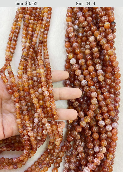 Fili di perle di agata crepa liscia