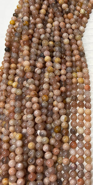 Brins de perles de pierre de soleil rondes et lisses naturelles
